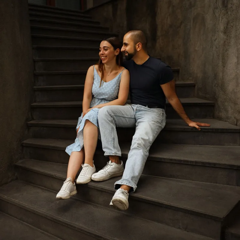 A young couple relaxing together outside their home